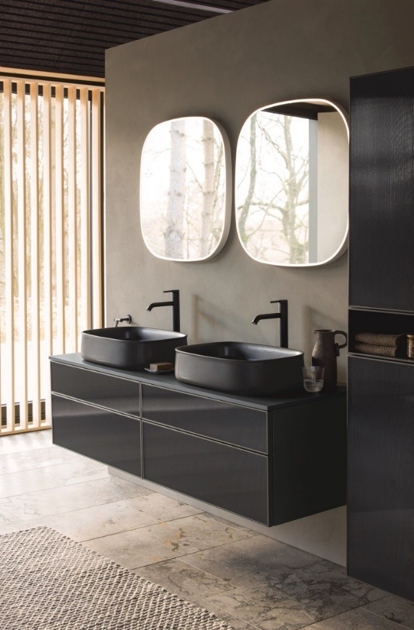 A bathroom with two black sinks AI-generated content may be incorrect.